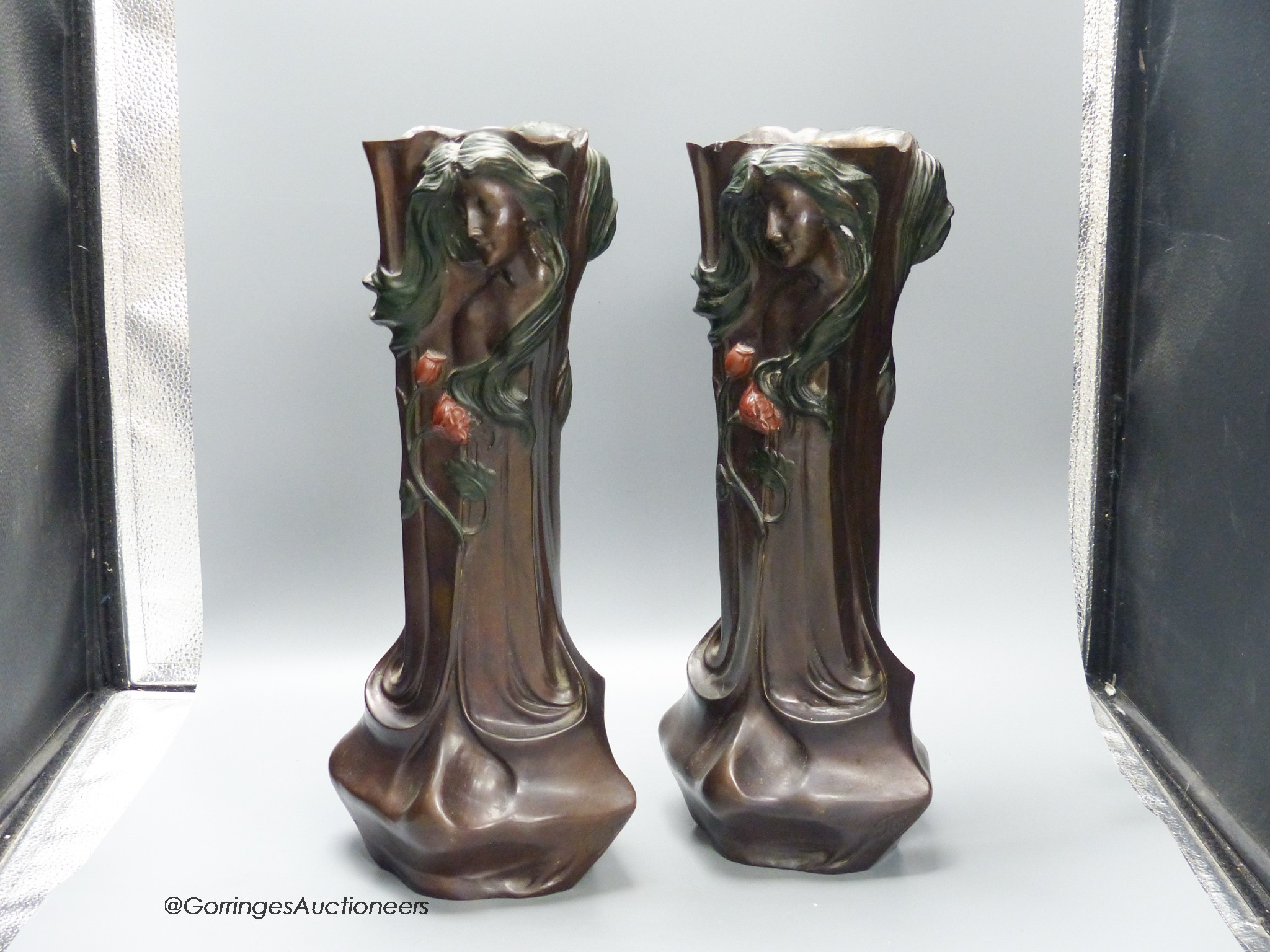 A pair of Art Nouveau style cold painted bronze figural vases, signed Flora, 42.5cm high